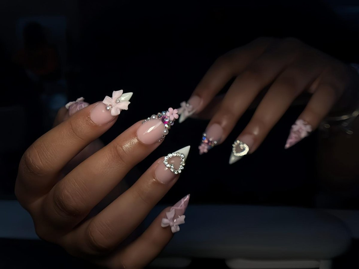 Pink stiletto nails with 3D floral art and crystals