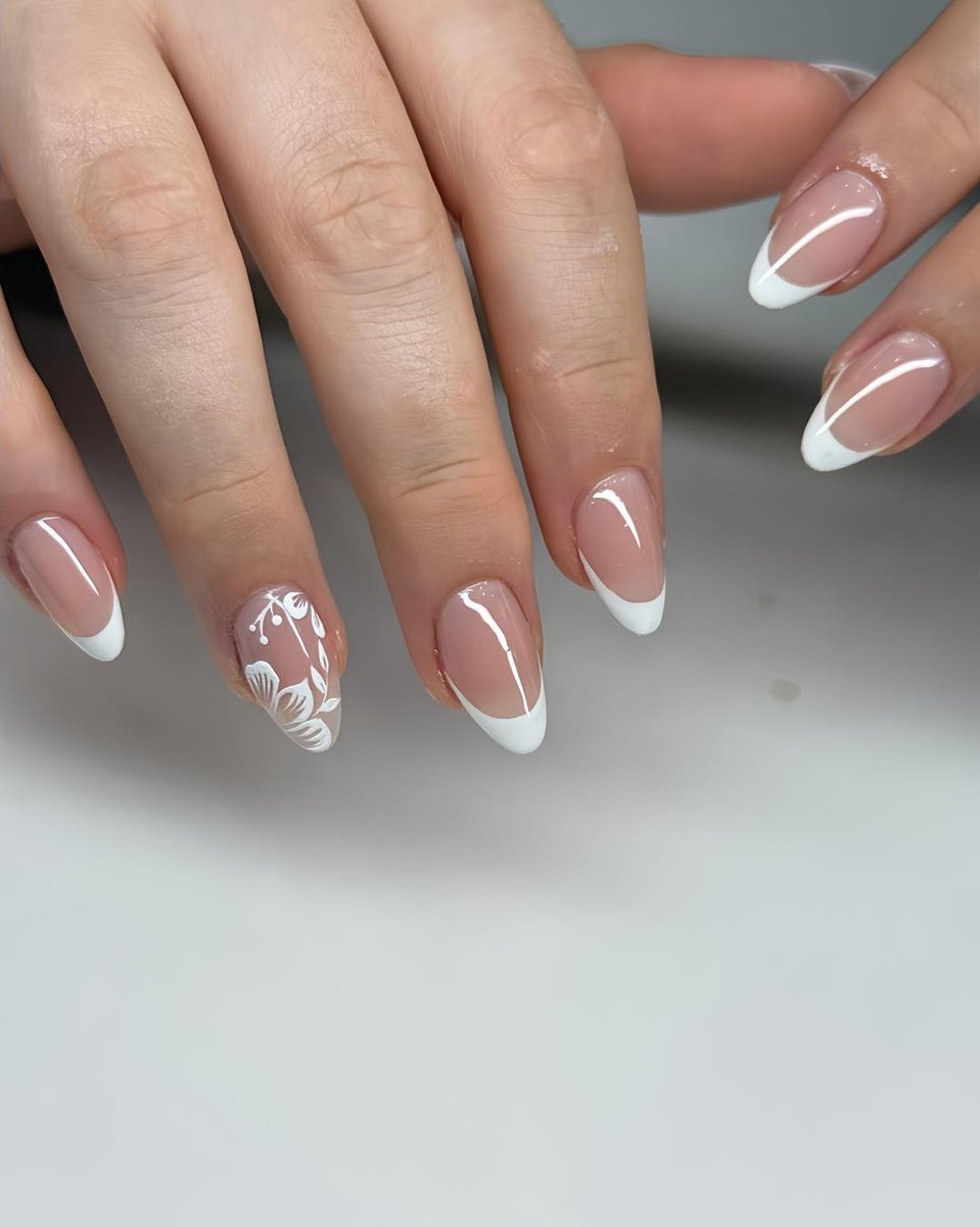 Classic white French manicure on almond nails