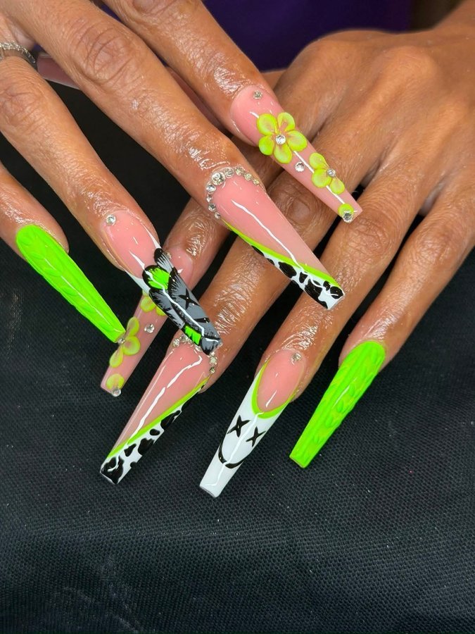 Neon green 3D flower nail art with cow print accents